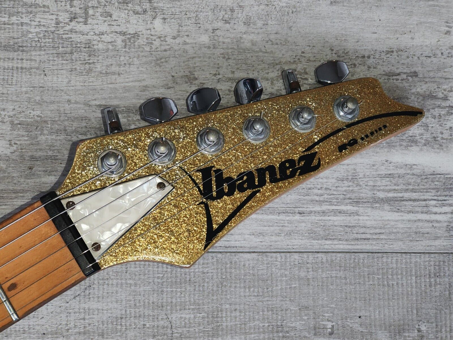 1990's Ibanez HSH RG Superstrat (Metallic Gold Flake w/Matching Headstock)