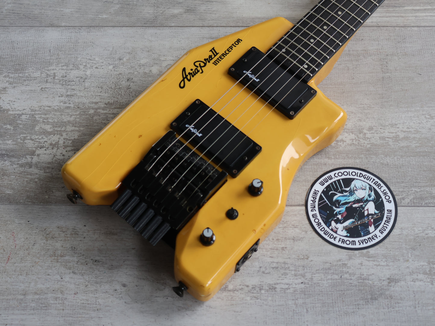 1986 Aria Pro II Japan Interceptor-II Headless Guitar (Yellowed White)