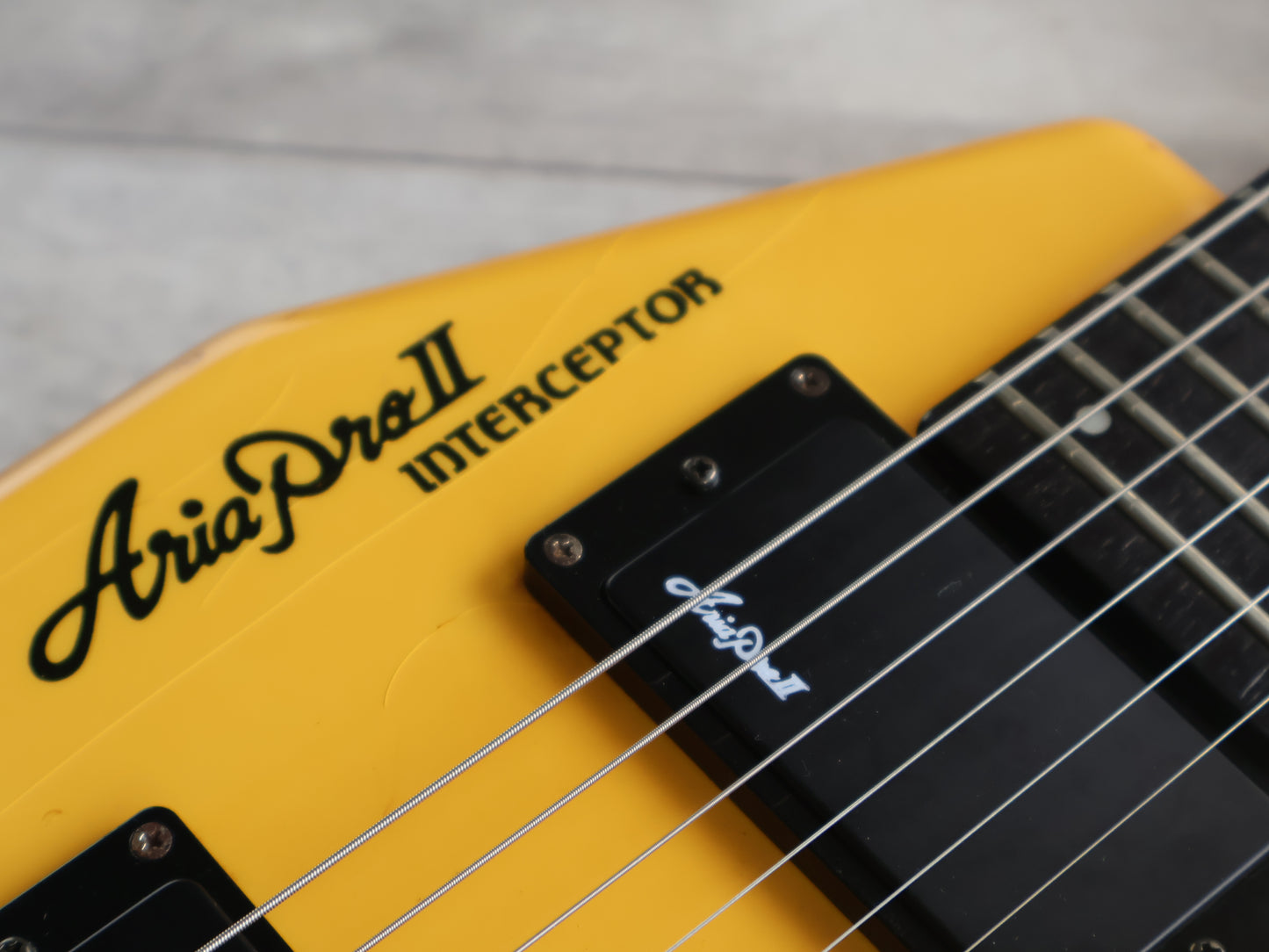 1986 Aria Pro II Japan Interceptor-II Headless Guitar (Yellowed White)